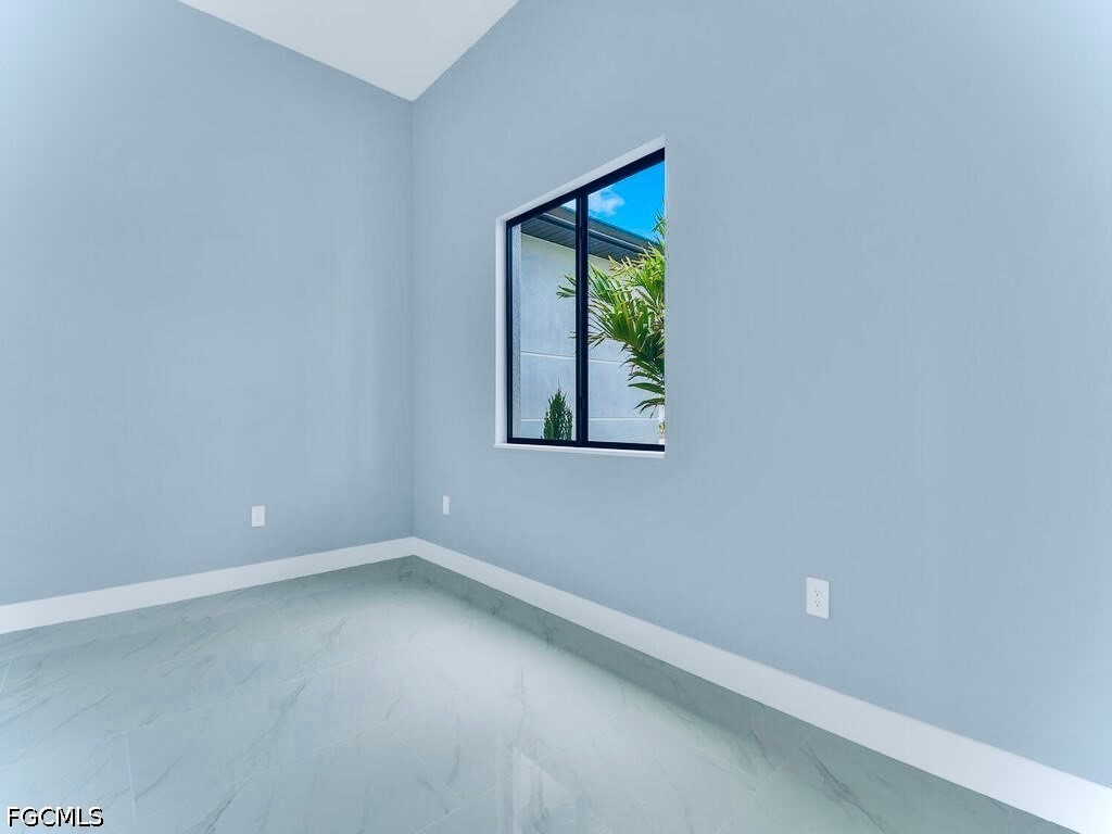 3517 2nd Street Southwest Lehigh Acres, FL 33976 - Photo 18 of 28 a view of an empty room with a window