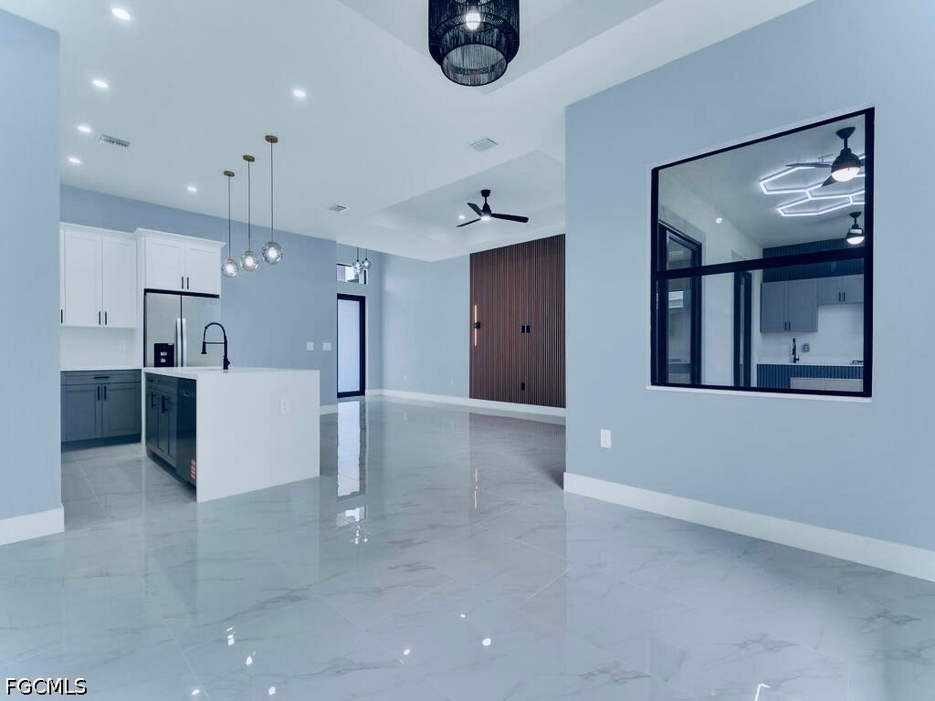 3517 2nd Street Southwest Lehigh Acres, FL 33976 - Photo 19 of 28 a view of a kitchen with refrigerator and windows
