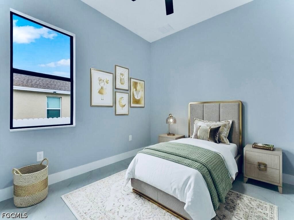 3517 2nd Street Southwest Lehigh Acres, FL 33976 - Photo 24 of 28 a bedroom with a bed and a painting on the wall