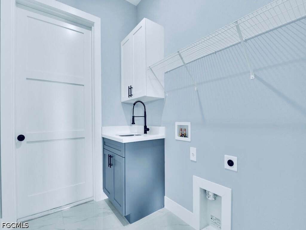 3517 2nd Street Southwest Lehigh Acres, FL 33976 - Photo 26 of 28 a bathroom with a sink a mirror and shower