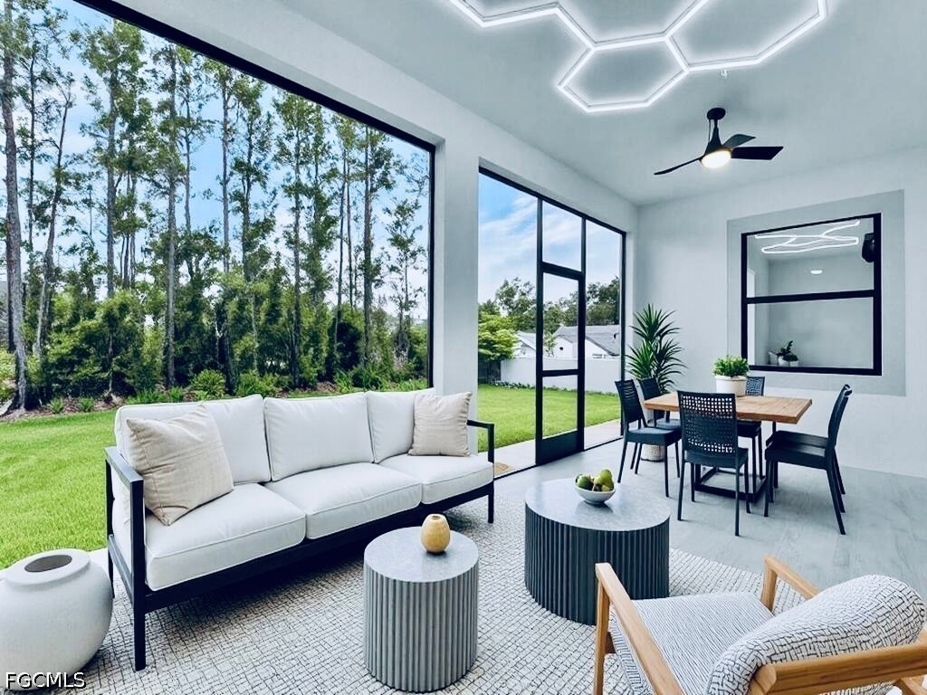 3517 2nd Street Southwest Lehigh Acres, FL 33976 - Photo 5 of 28 a living room with furniture and a large window
