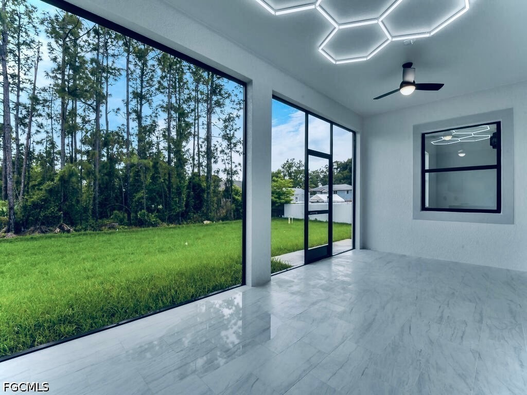 3517 2nd Street Southwest Lehigh Acres, FL 33976 - Photo 6 of 28 a view of a room with next to a yard