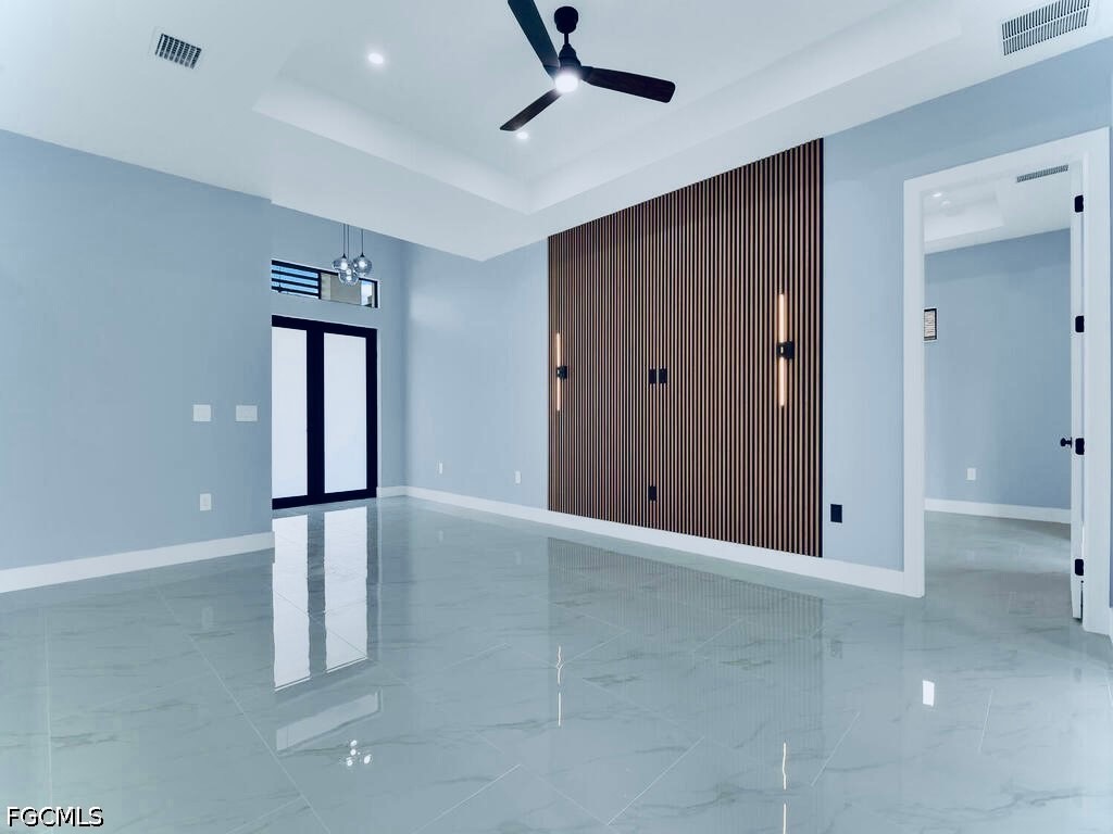 3517 2nd Street Southwest Lehigh Acres, FL 33976 - Photo 9 of 28 an empty room with windows and closet