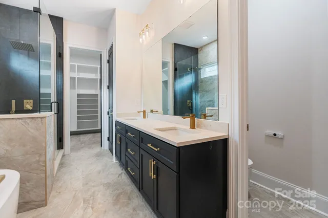 a bathroom with a double vanity sink and mirror