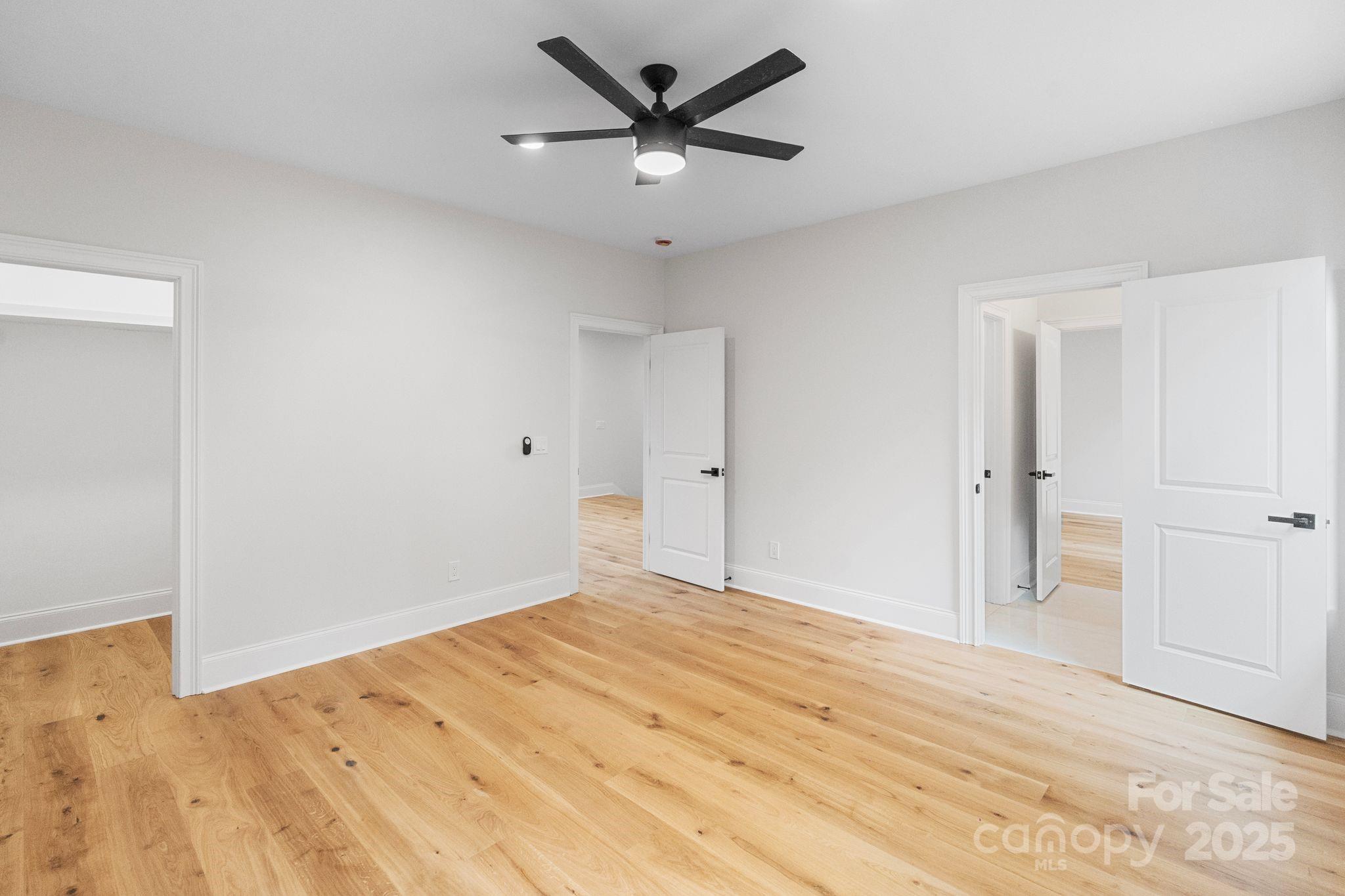 3204 Chancellor Lane Monroe, NC 28110 - Photo 32 of 48 a view of a livingroom with a ceiling fan