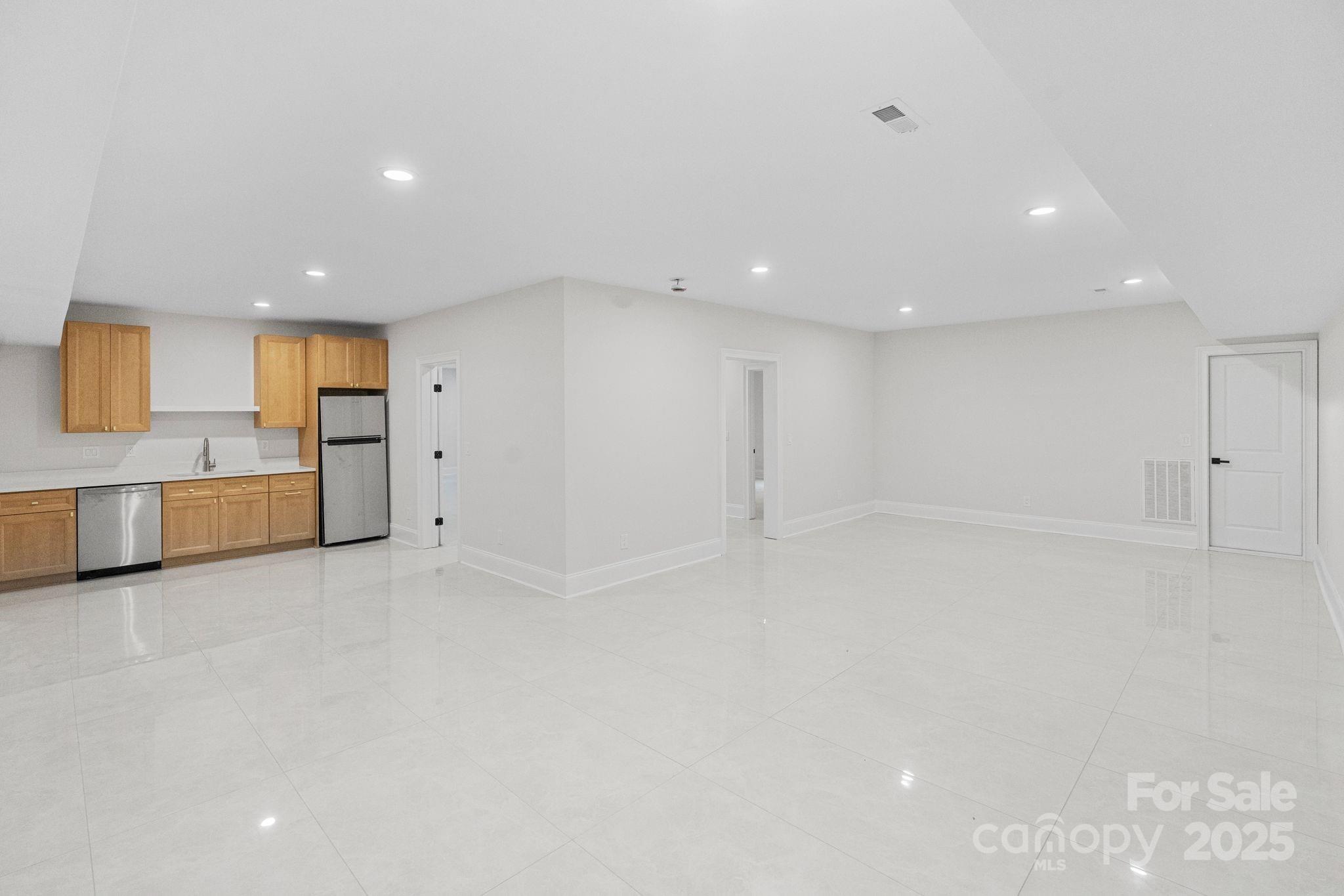 3204 Chancellor Lane Monroe, NC 28110 - Photo 44 of 48 a view of a kitchen with a sink and a refrigerator
