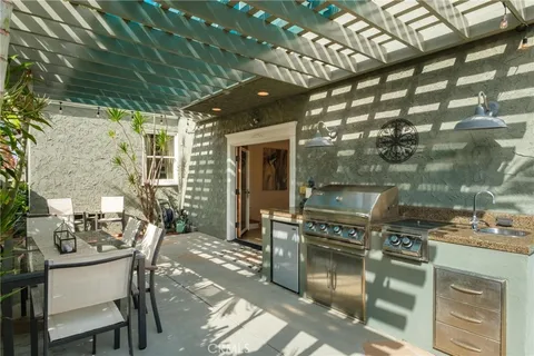 a patio with table and chairs