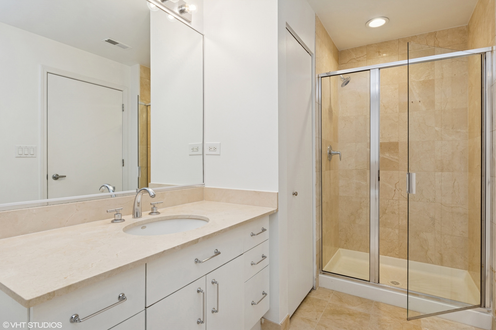 1260 West Washington Boulevard, Unit 504 Chicago, IL 60607 - Photo 13 of 23 a bathroom with a shower sink and mirror