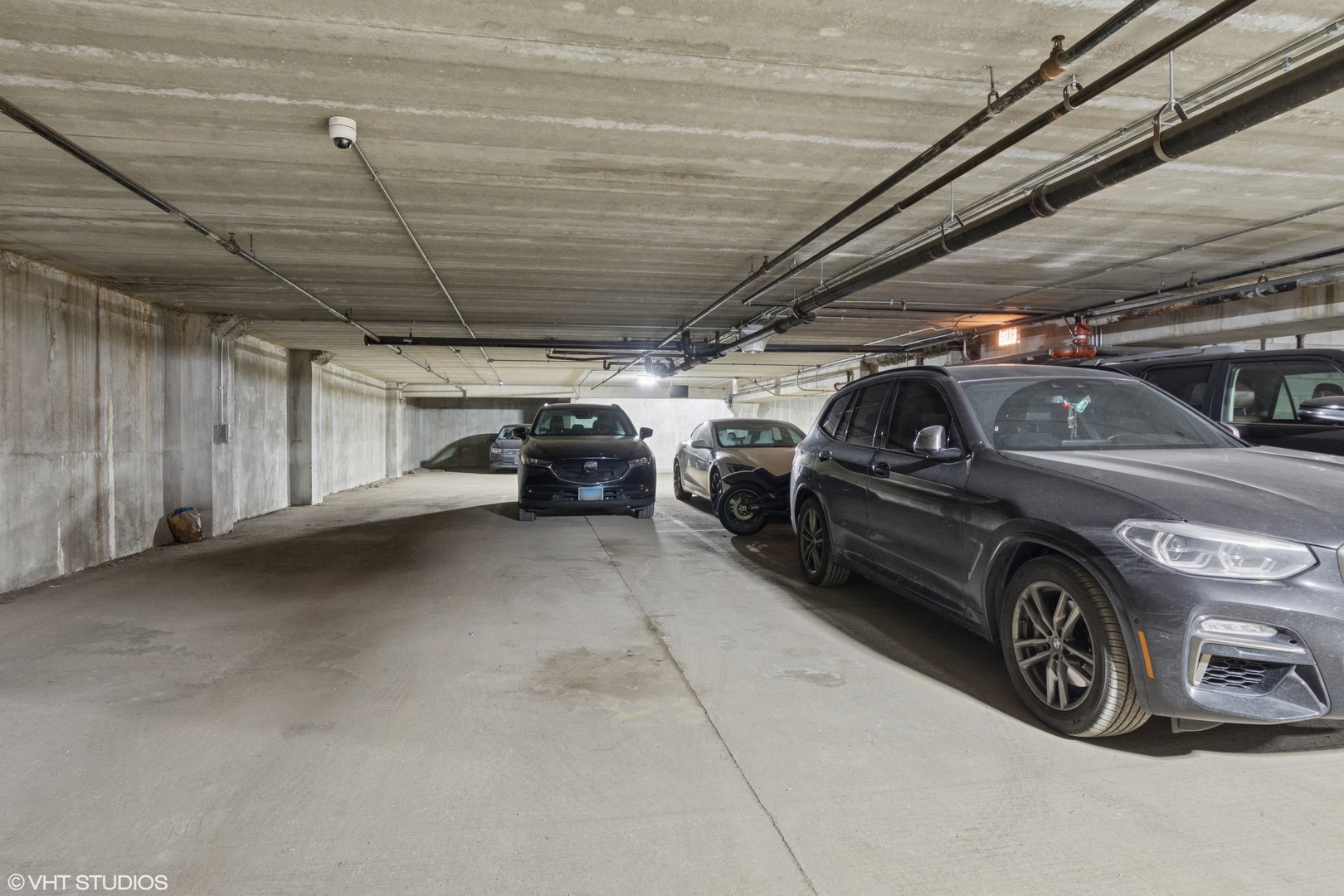1260 West Washington Boulevard, Unit 504 Chicago, IL 60607 - Photo 22 of 23 a view of parking garage with cars