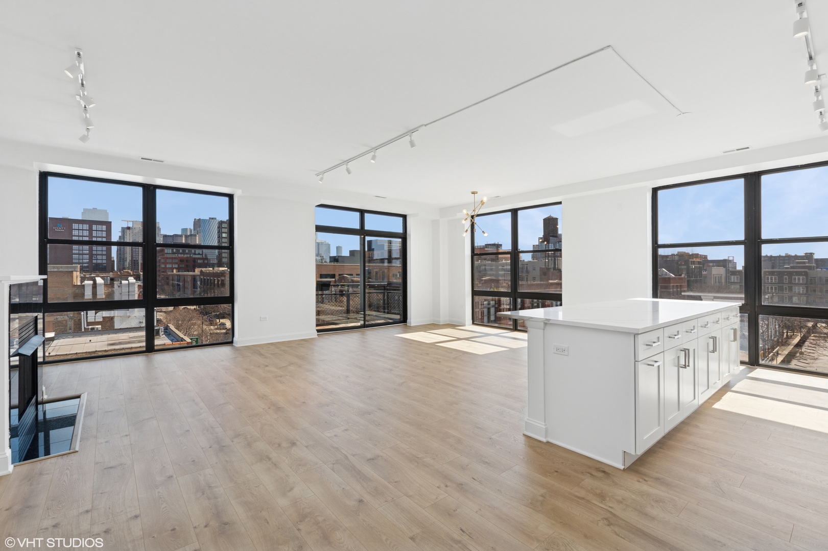 1260 West Washington Boulevard, Unit 504 Chicago, IL 60607 - Photo 4 of 23 a view of an empty room with window and wooden floor