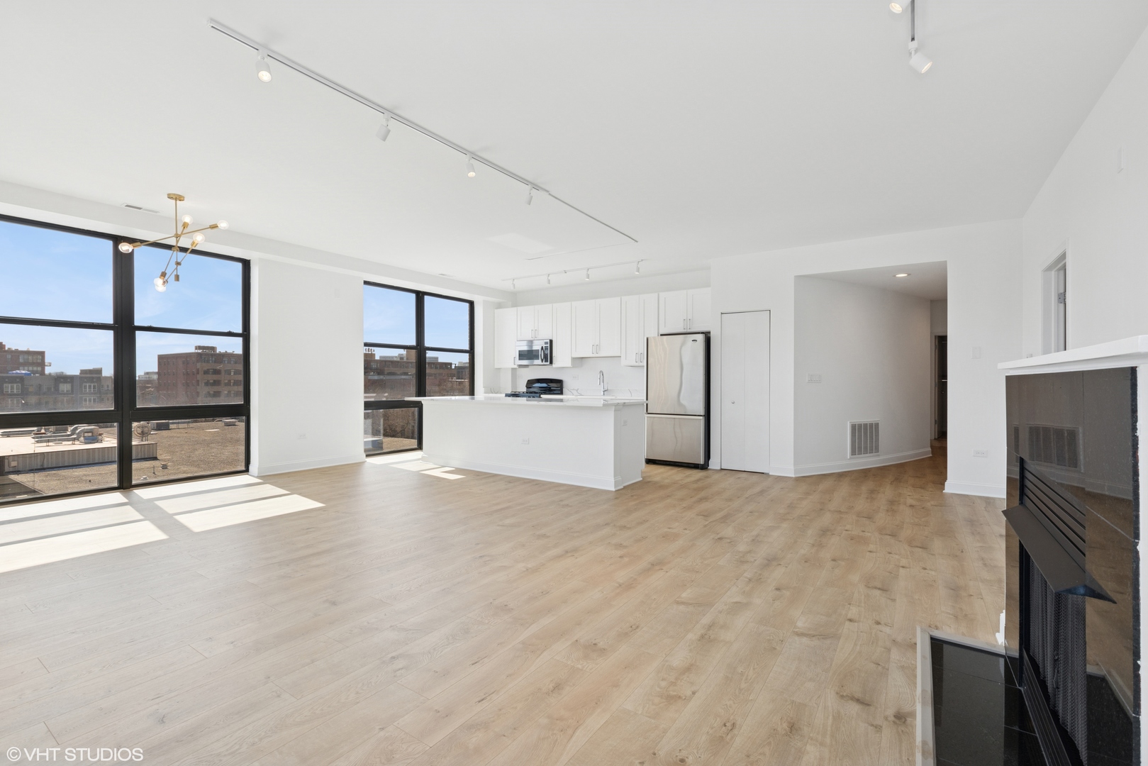 1260 West Washington Boulevard, Unit 504 Chicago, IL 60607 - Photo 7 of 23 a view of a kitchen with a sink and a refrigerator