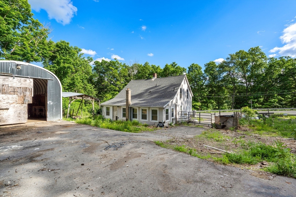 190 Ware Road Warren, MA 01092 - Photo 16 of 17 front view of a house with a tree in a yard