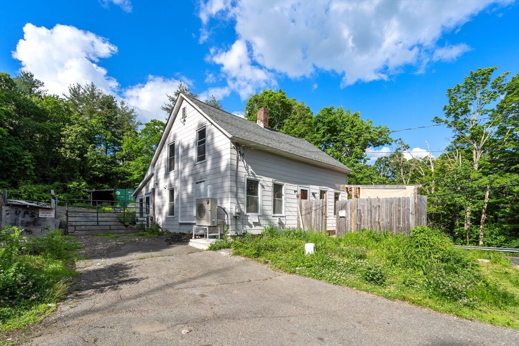 190 Ware Road Warren, MA 01092 - Photo 2 of 17 a view of a house with yard and a garden