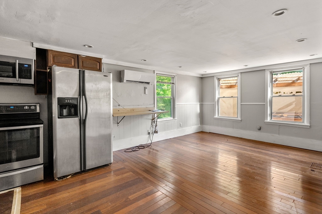 190 Ware Road Warren, MA 01092 - Photo 3 of 17 a view of a kitchen with wooden floor electronic appliances and windows