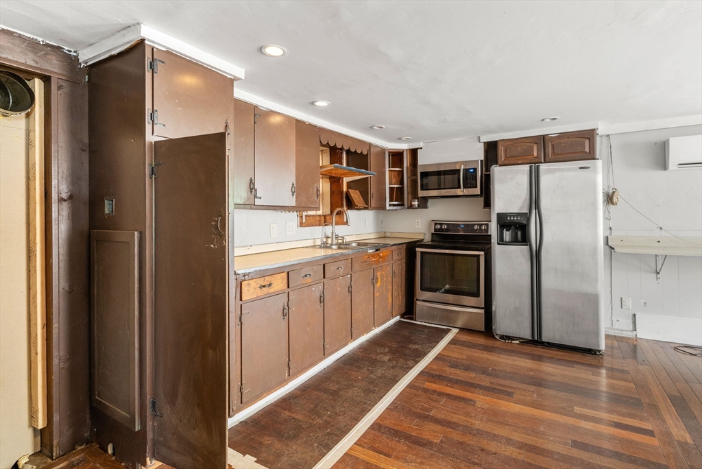 190 Ware Road Warren, MA 01092 - Photo 4 of 17 a kitchen with stainless steel appliances granite countertop a refrigerator and a stove top oven