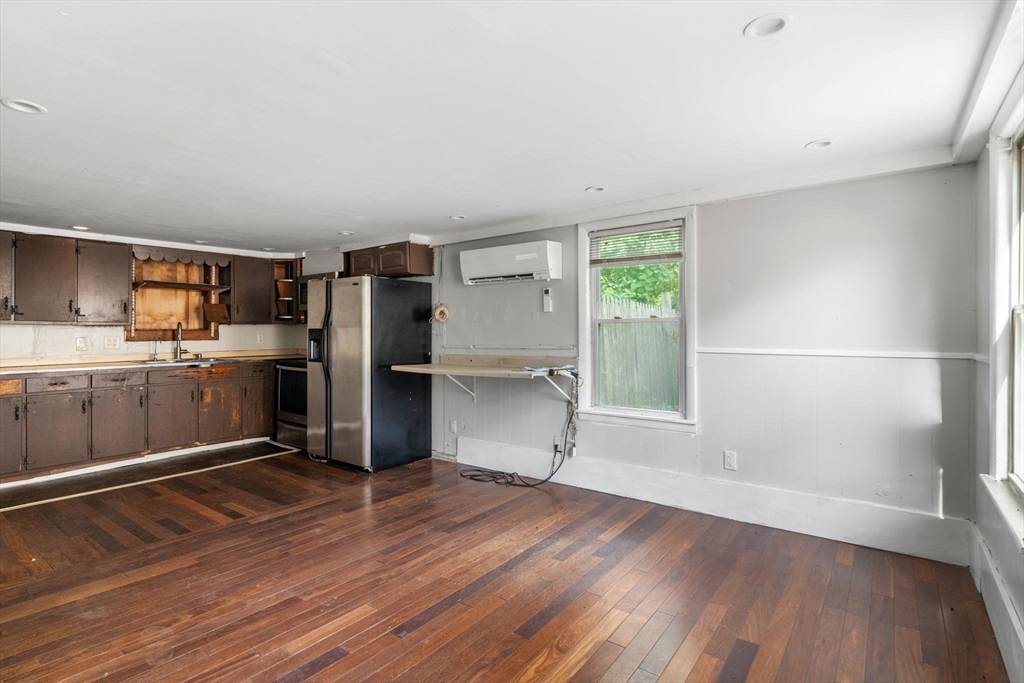 190 Ware Road Warren, MA 01092 - Photo 5 of 17 a kitchen with granite countertop a refrigerator and wooden floor