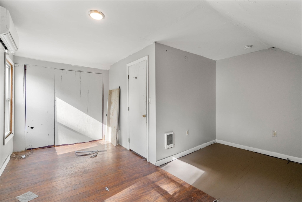 190 Ware Road Warren, MA 01092 - Photo 10 of 17 an empty room with wooden floor and white walls