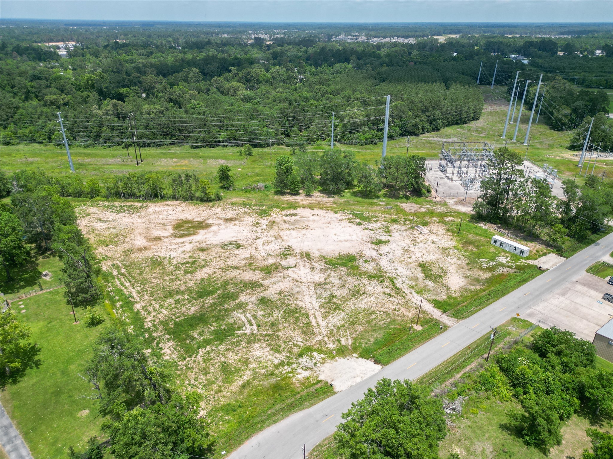 15015 Calhoun Road Conroe, TX 77302 - Photo 18 of 31 a view of a garden with a lake