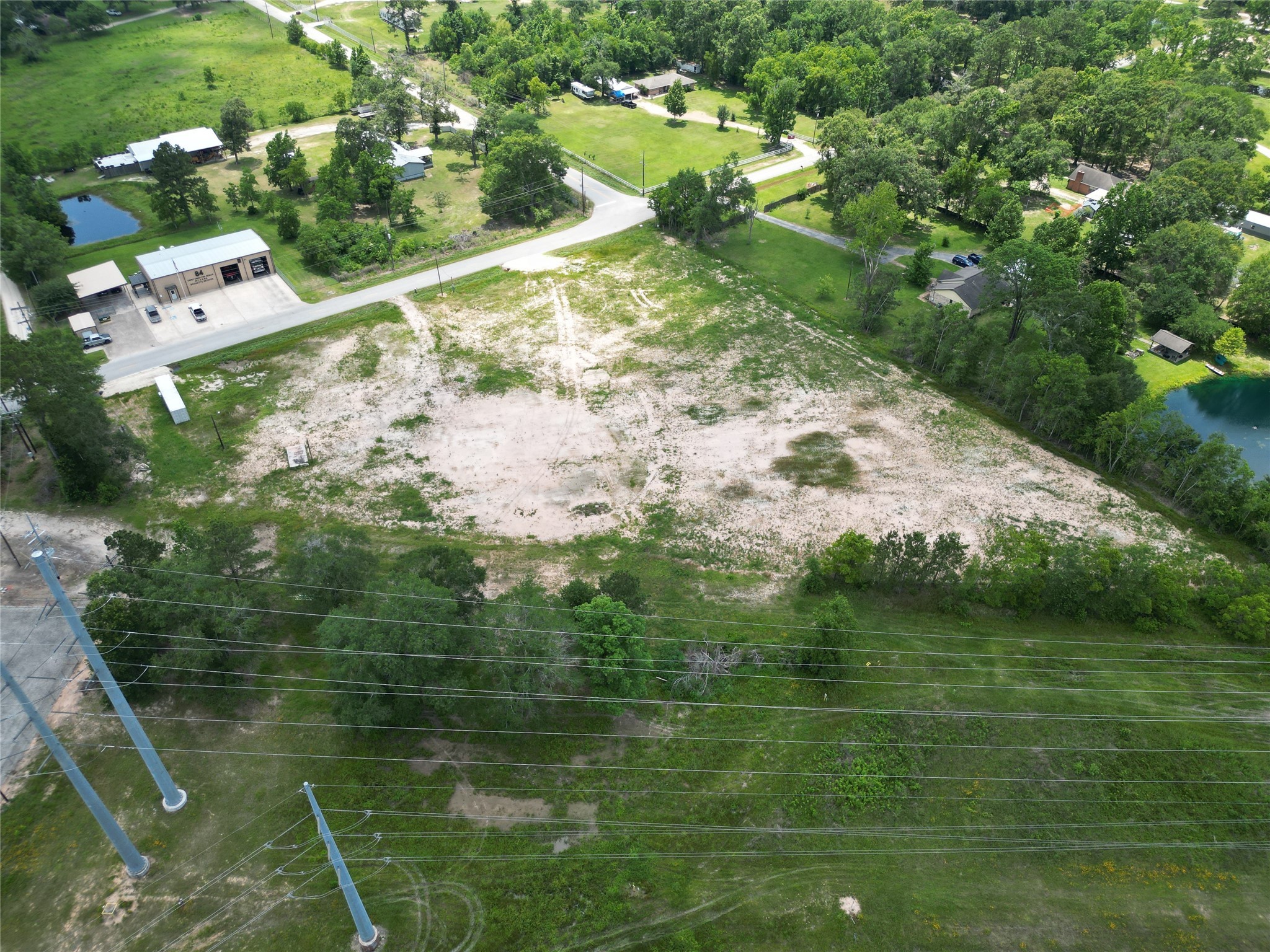 15015 Calhoun Road Conroe, TX 77302 - Photo 24 of 31 a view of a lake with huge green field