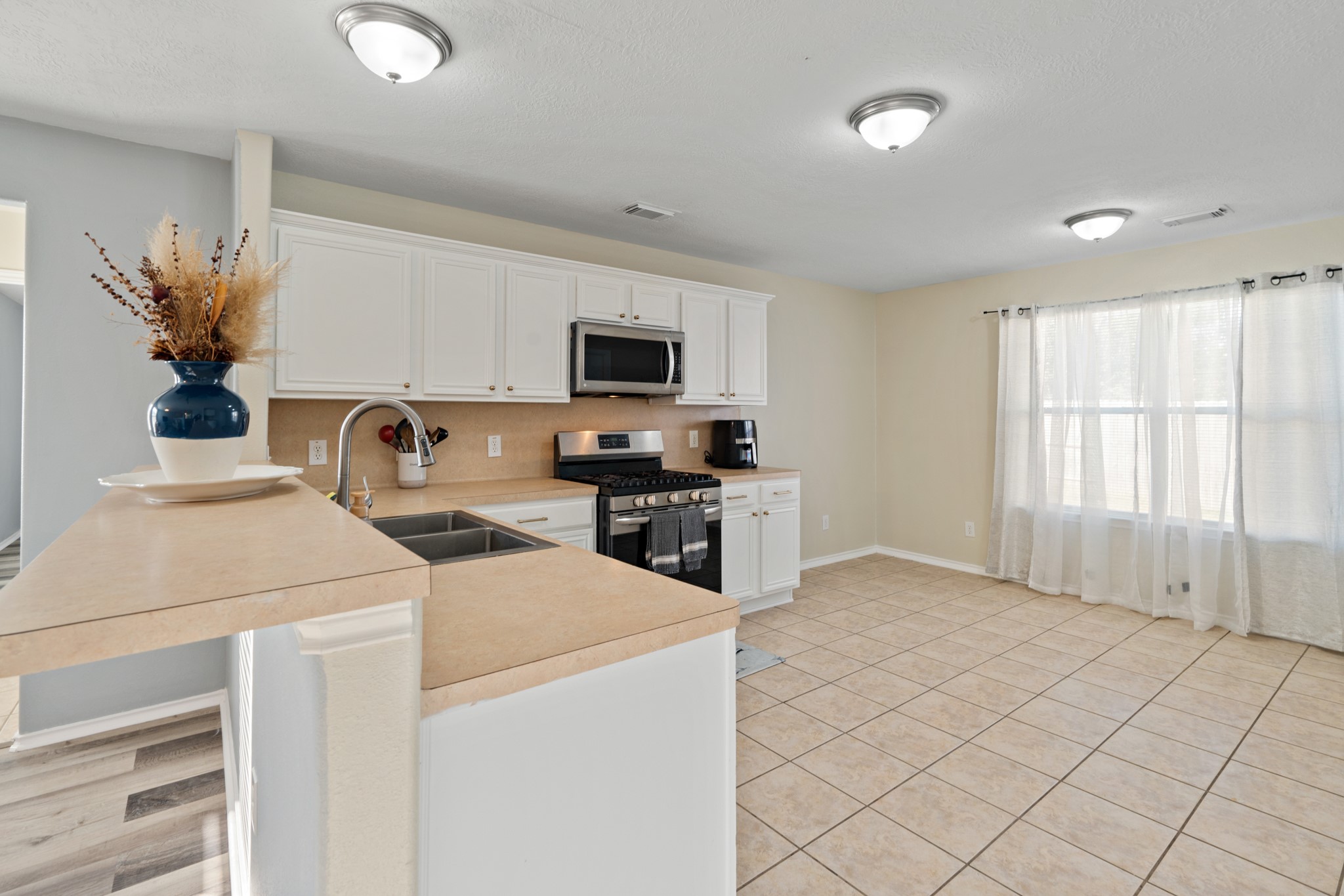 20807 Carsen Spring Court Katy, TX 77449 - Photo 12 of 31 a kitchen that has a sink and a stove