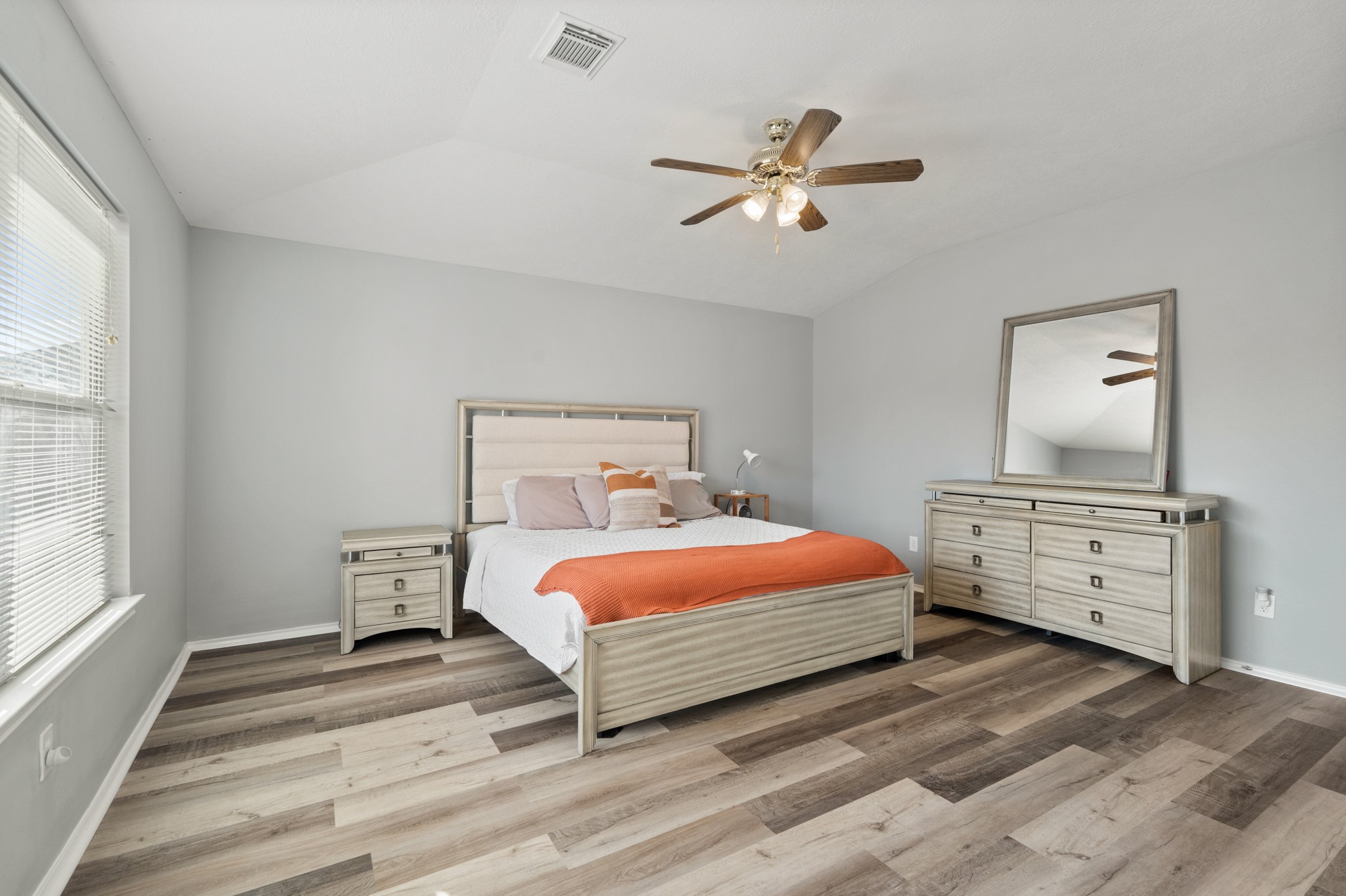 20807 Carsen Spring Court Katy, TX 77449 - Photo 18 of 31 a bedroom with a bed and wooden floor
