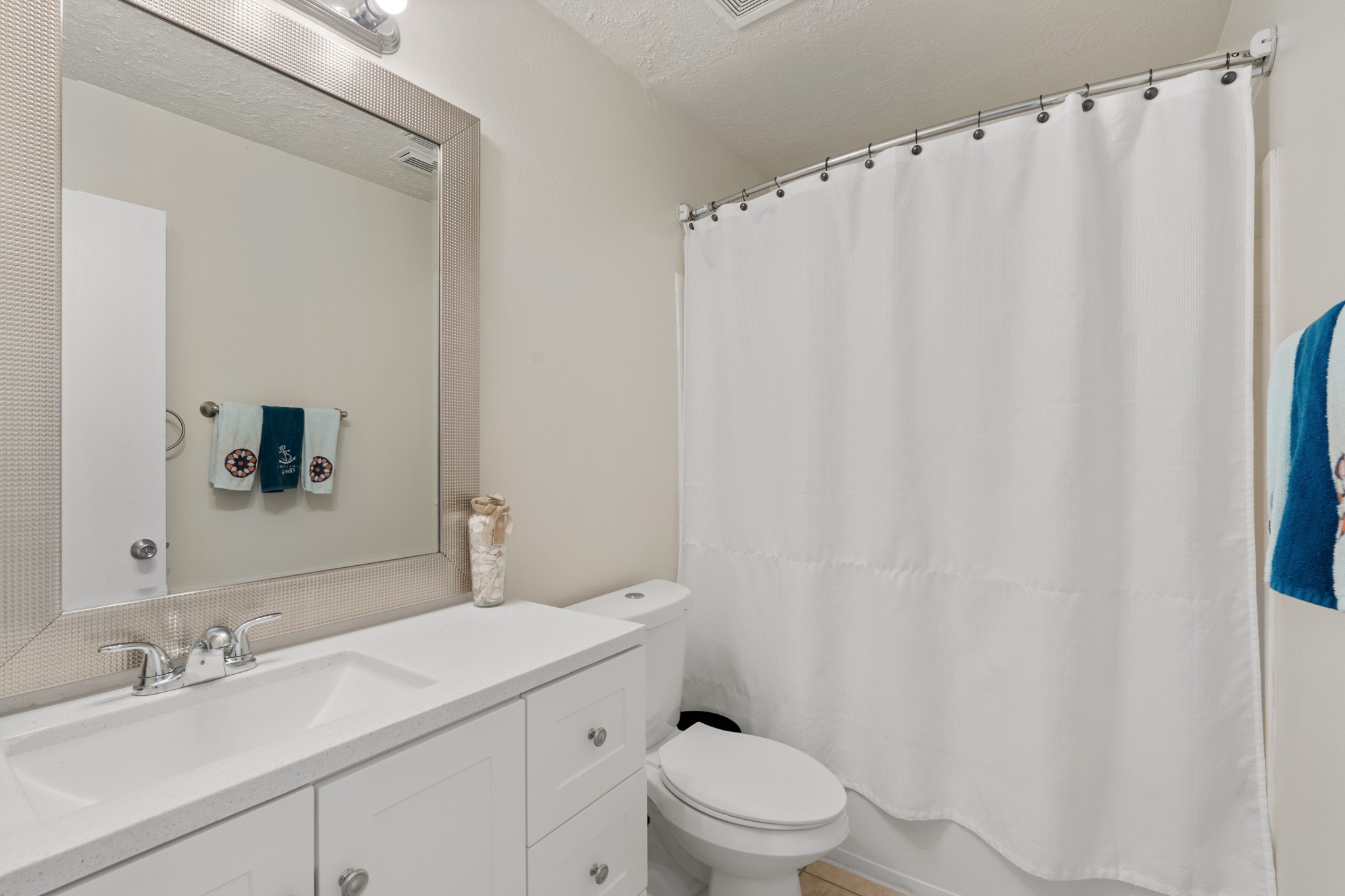 20807 Carsen Spring Court Katy, TX 77449 - Photo 24 of 31 a bathroom with a sink a toilet and shower curtain