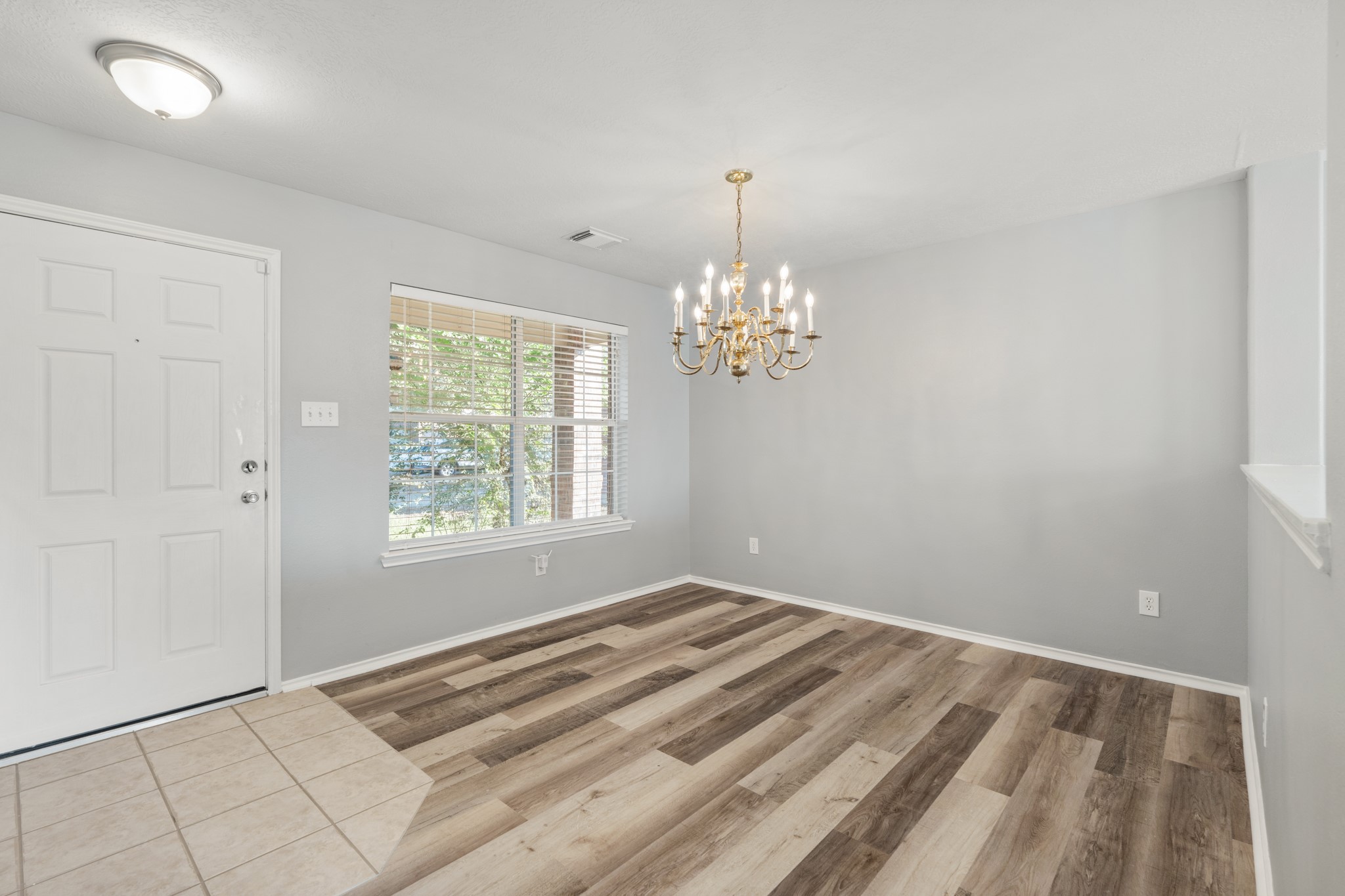 20807 Carsen Spring Court Katy, TX 77449 - Photo 7 of 31 wooden floor in an empty room with a window
