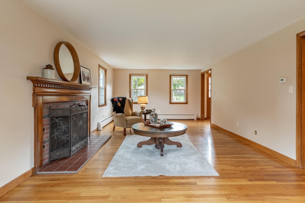 6 Longview Road Chelmsford, MA 01824 - Photo 11 of 40 a living room with furniture and a fireplace