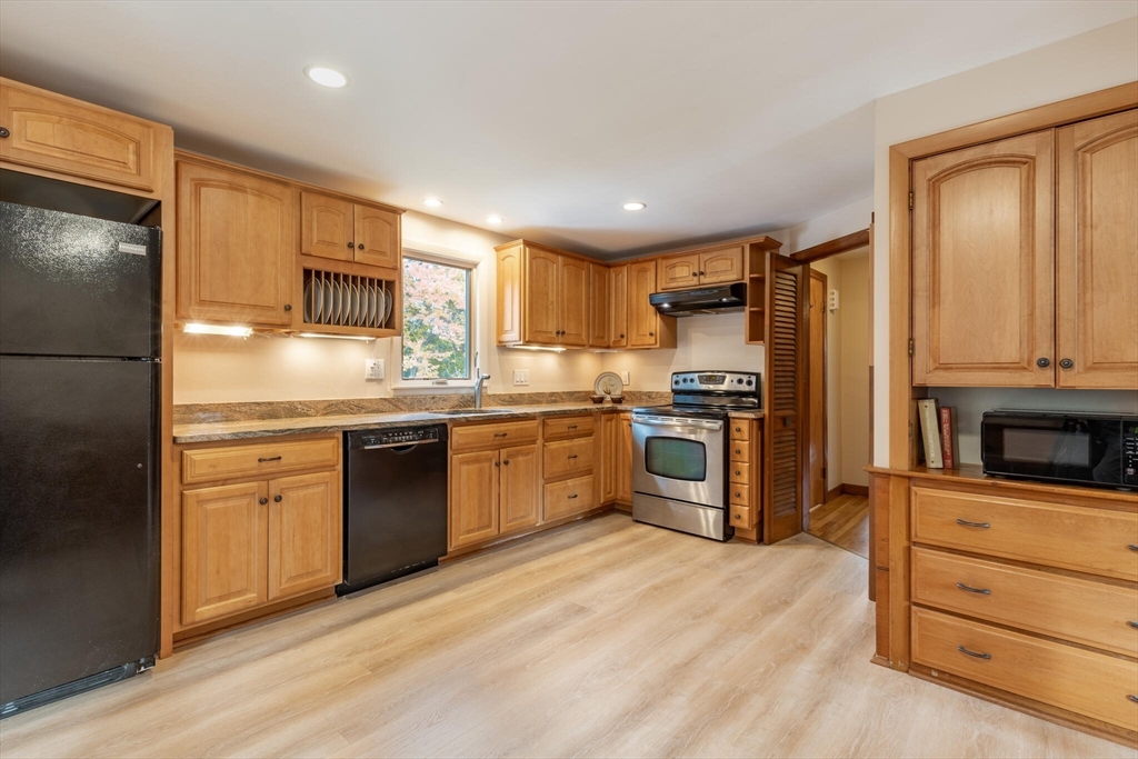 6 Longview Road Chelmsford, MA 01824 - Photo 13 of 40 a kitchen with granite countertop cabinets stainless steel appliances and a window