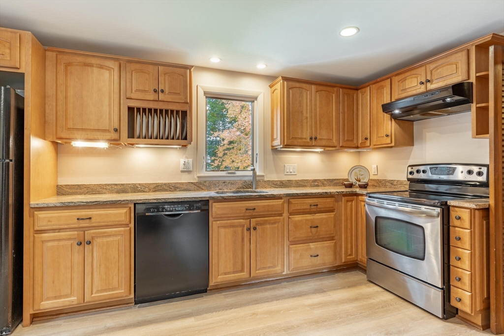 6 Longview Road Chelmsford, MA 01824 - Photo 14 of 40 a kitchen with stainless steel appliances granite countertop a stove a sink and a microwave