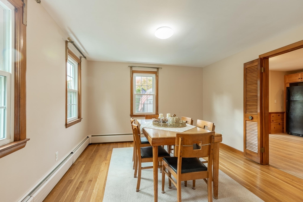 6 Longview Road Chelmsford, MA 01824 - Photo 18 of 40 a dining room with furniture and wooden floor