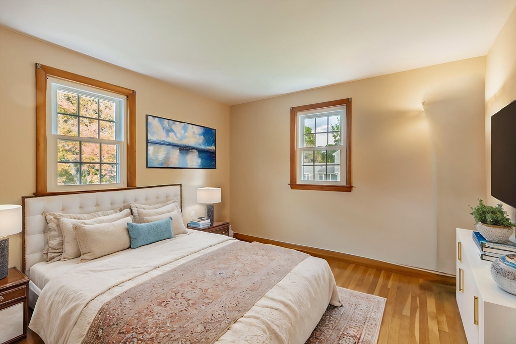 6 Longview Road Chelmsford, MA 01824 - Photo 27 of 40 a bedroom with a bed and a flat screen tv