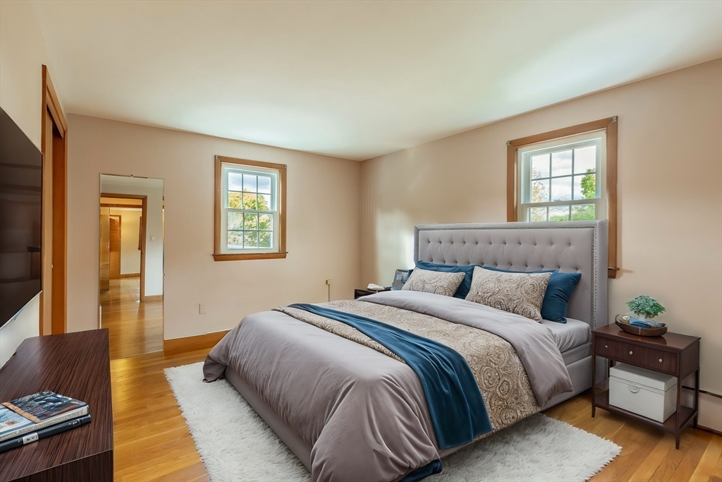 6 Longview Road Chelmsford, MA 01824 - Photo 29 of 40 a bedroom with a bed and wooden floor