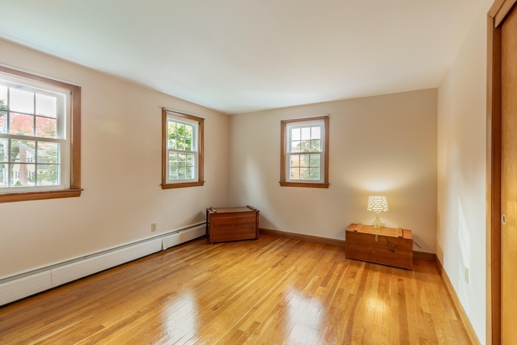 6 Longview Road Chelmsford, MA 01824 - Photo 30 of 40 a bedroom with a bed and wooden floor