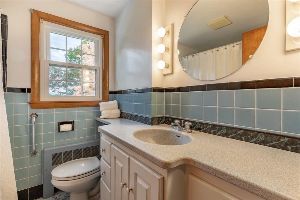 6 Longview Road Chelmsford, MA 01824 - Photo 31 of 40 a bathroom with a sink a toilet and a mirror