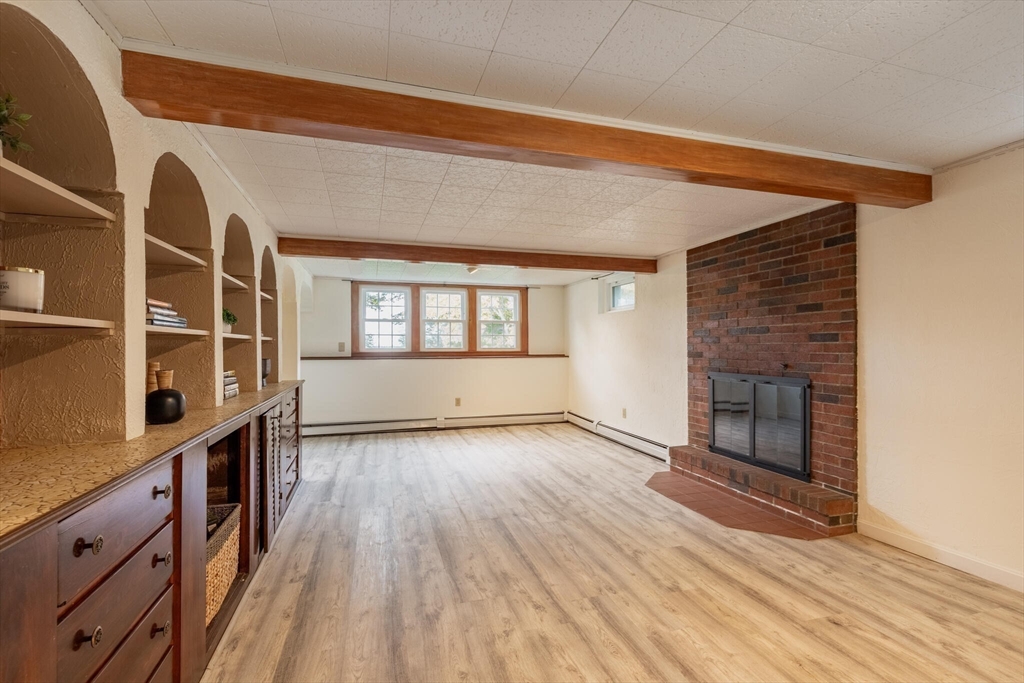 6 Longview Road Chelmsford, MA 01824 - Photo 32 of 40 wooden floor in an empty room with a window