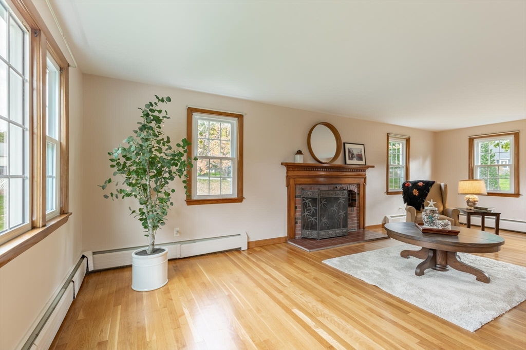 6 Longview Road Chelmsford, MA 01824 - Photo 9 of 40 a living room with furniture and a fireplace