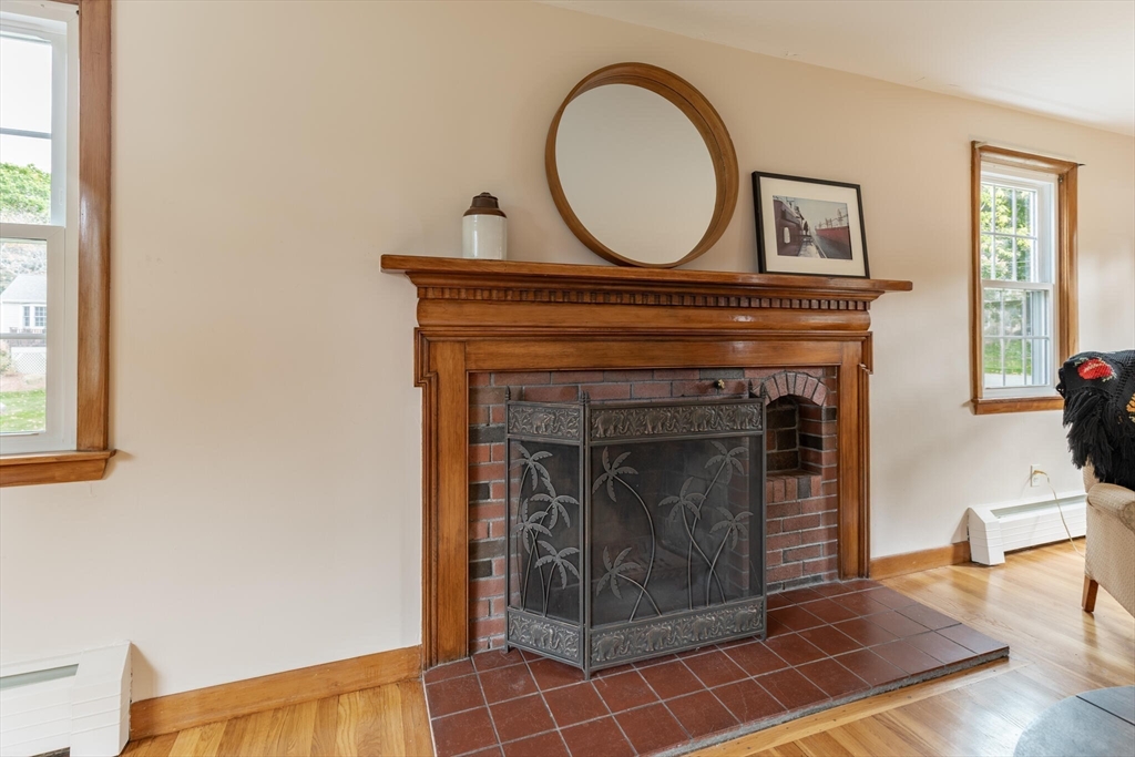 6 Longview Road Chelmsford, MA 01824 - Photo 10 of 40 a living room with furniture a fireplace and a window