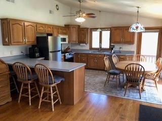 104 Srader Grove Road Freeport, PA 16229 - Photo 9 of 32 a dining room with furniture a chandelier and wooden floor