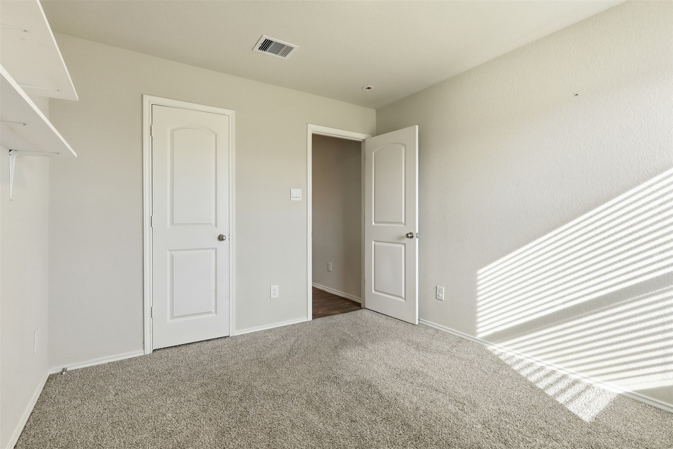 2346 Gold Forsythia Ln Spring Spring, TX 77373 - Photo 23 of 39 Bright and inviting secondary bedroom with ample natural light and cozy carpeting.