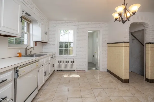 a kitchen with a refrigerator a sink and dishwasher