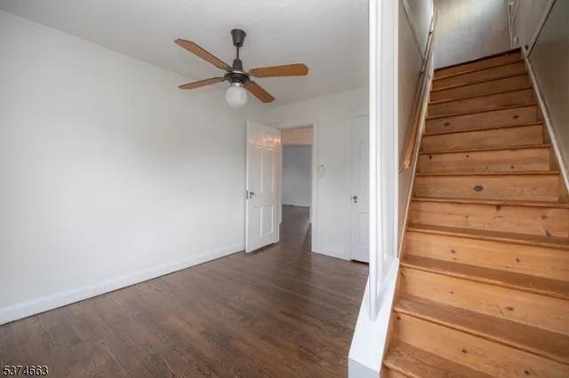 a view of an entryway with wooden floor