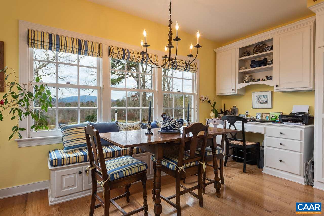 6008 Midway Road, Unit REVEILLE Charlottesville, VA 22903 - Photo 16 of 39 a dining room with furniture a chandelier and wooden floor