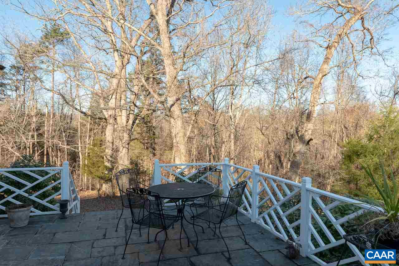 6008 Midway Road, Unit REVEILLE Charlottesville, VA 22903 - Photo 26 of 39 a backyard of a house with table and chairs
