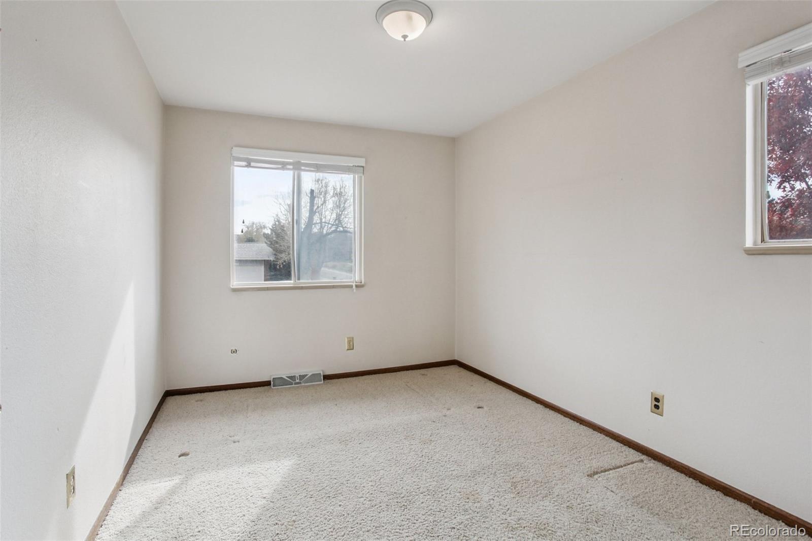 6689 South Delaware Street Littleton, CO 80120 - Photo 15 of 25 an empty room with windows