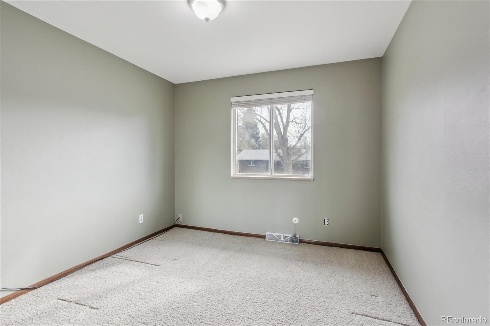 6689 South Delaware Street Littleton, CO 80120 - Photo 16 of 25 an empty room with windows