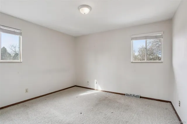 an empty room with windows