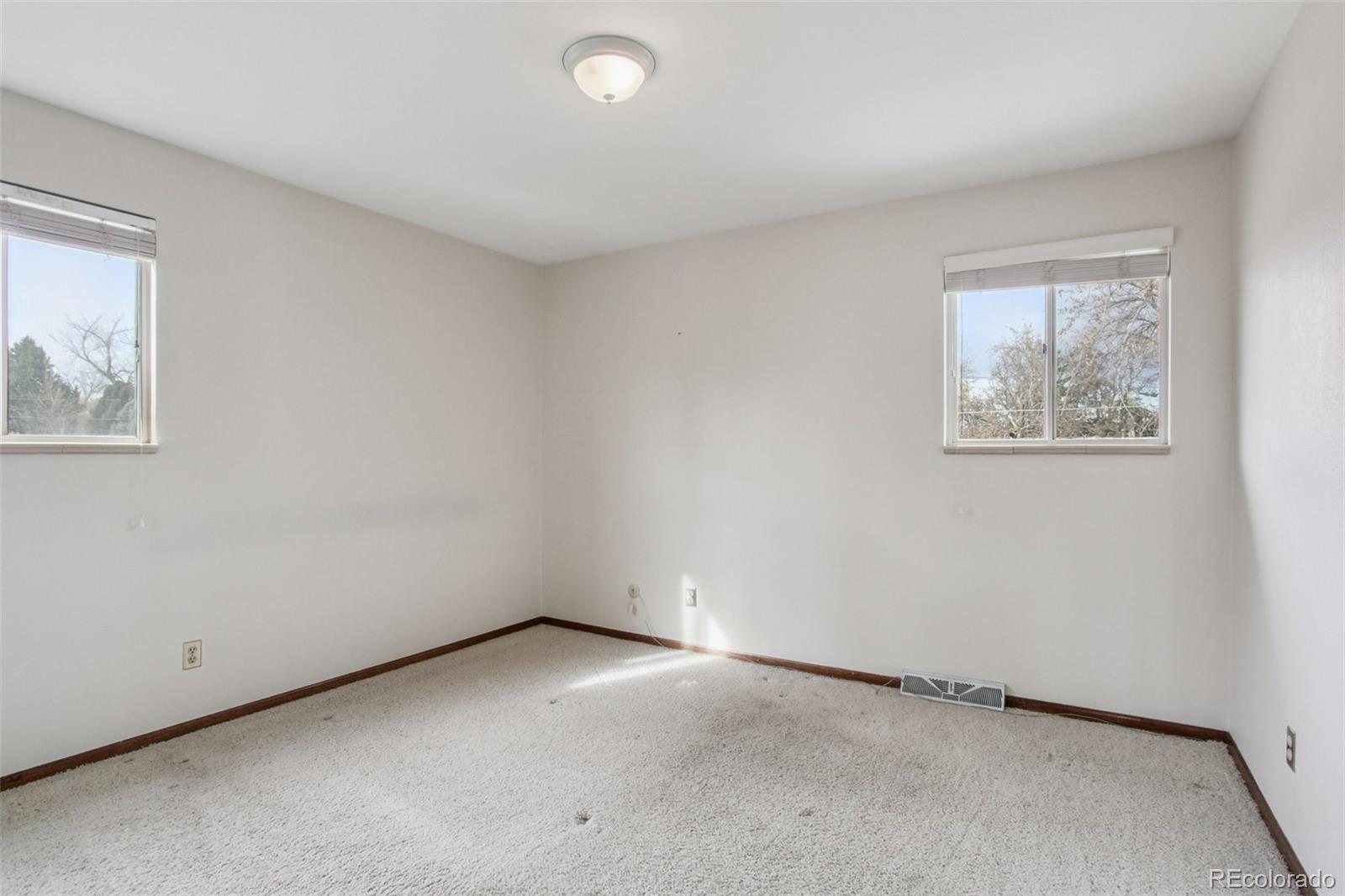 6689 South Delaware Street Littleton, CO 80120 - Photo 18 of 25 an empty room with windows