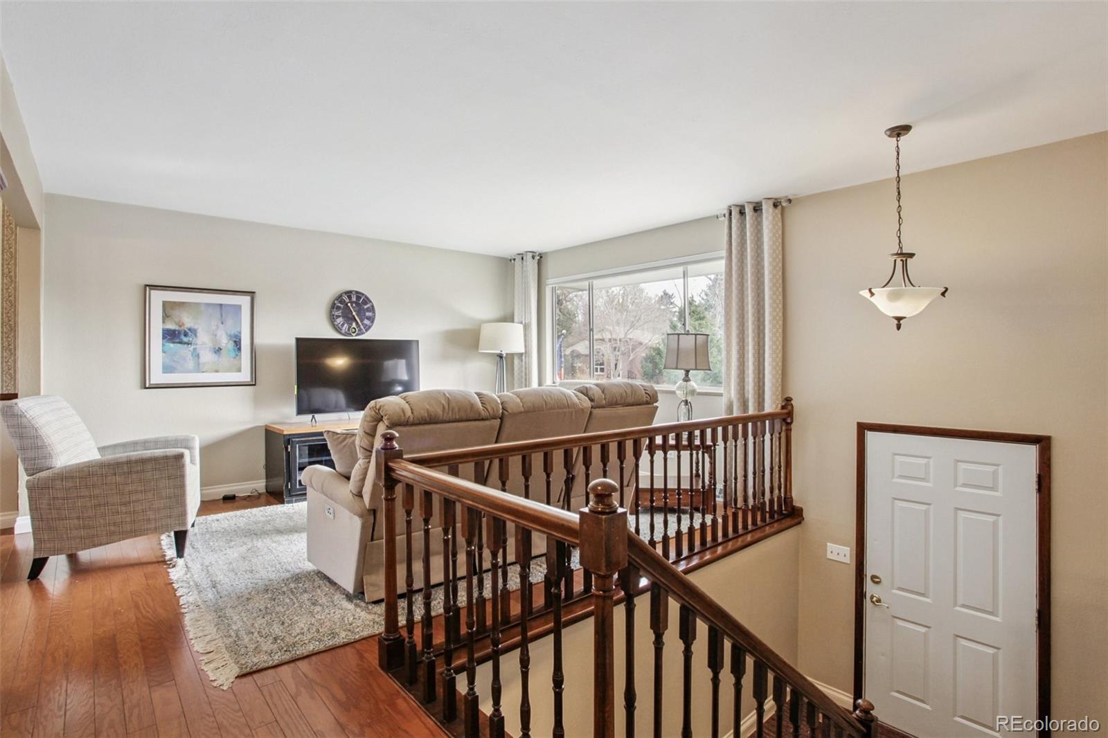6689 South Delaware Street Littleton, CO 80120 - Photo 5 of 25 a bedroom with furniture and a window