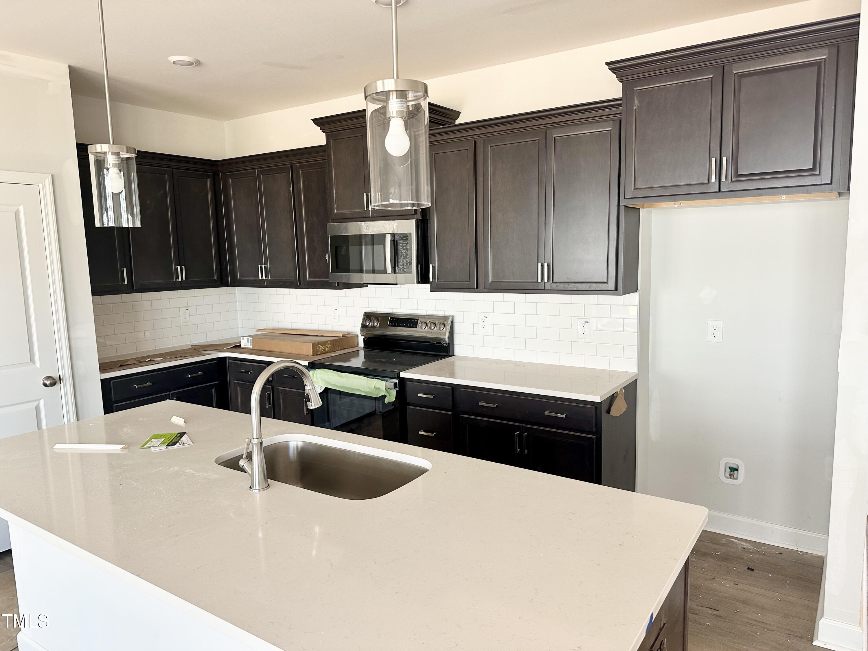 157 Ripple Way, Unit 207 Clayton, NC 27520 - Photo 2 of 23 BHB207 Kitchen 08092025